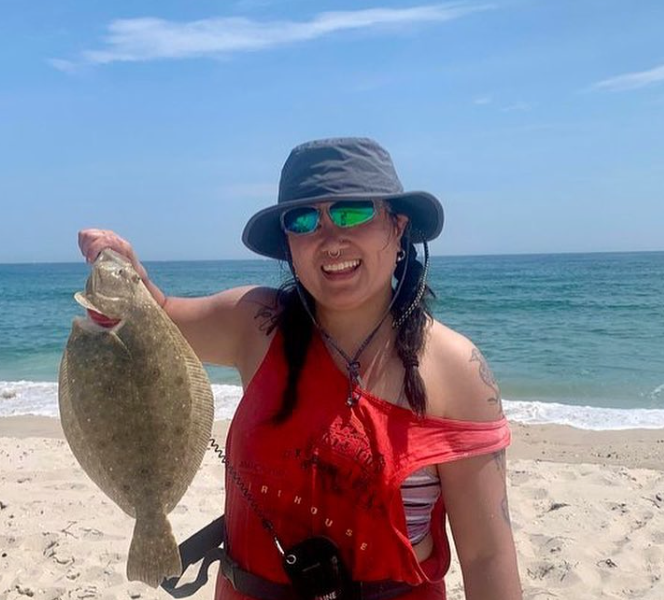 Fishadelphia's Feini holds a summer flounder!