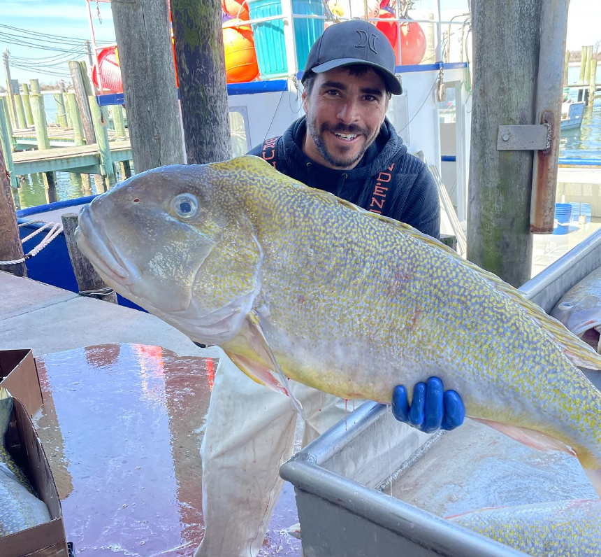 Viking Village fisherman holds up freshly caught jumbo tilefish