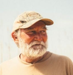 headshot of George Mathis wearing a ballcap