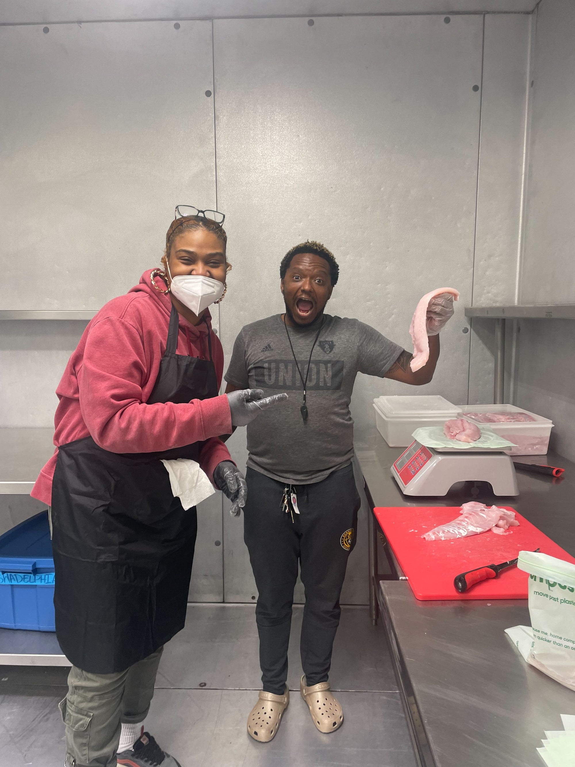 Tasha and Omi (making a funny face) in the Alt Kitchen cold room