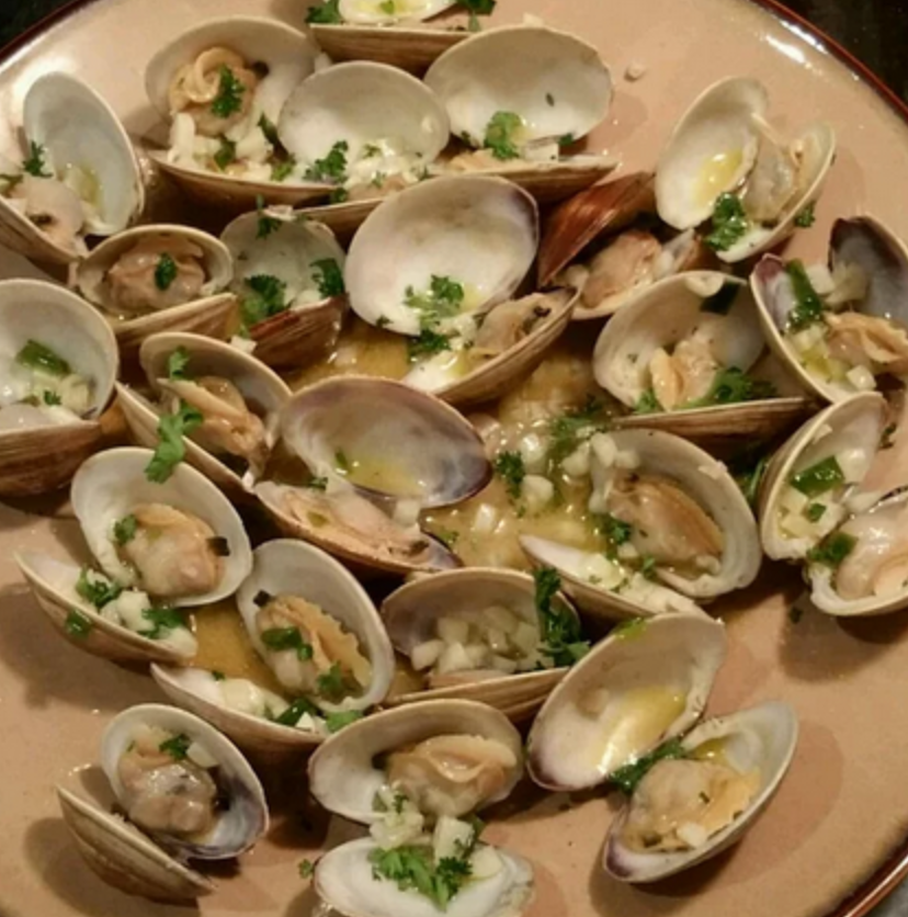 sauteed clams with white wine on a plate