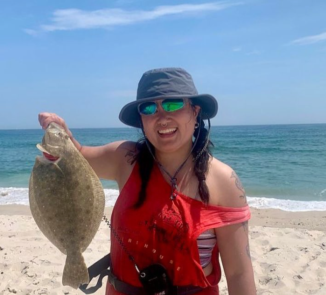 Fishadelphia's Feini holds a summer flounder! 