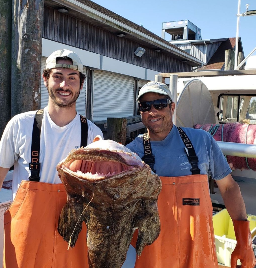 Viking Village fisherman holds freshly caught monkfish