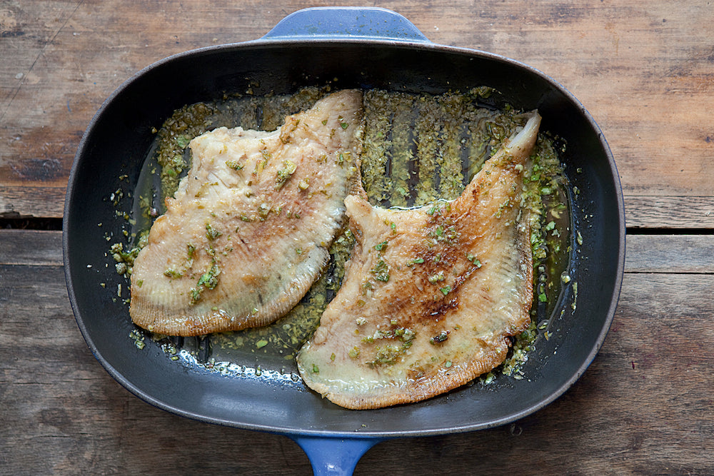 Skate with green herb sauce sitting in pan by Andy Sewell 